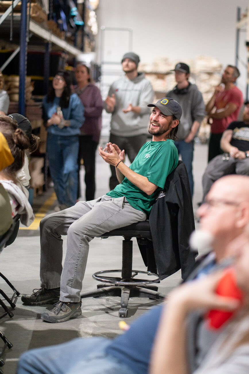 Adventure Factory team member laughing during an all-hands on the shop floor